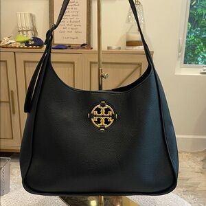 Black Leather Shoulder Bag with Gold Emblem